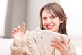 Woman succesfully using her tablet and smiling Royalty Free Stock Photo