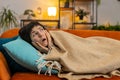 Woman suddenly wakes up from nightmare while sleeping on couch due to anxiety disorder bad dreams