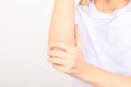 Woman suffering from chronic joint rheumatism. Elbow pain and treatment concept.