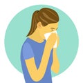 A woman suffering from flu in winter season. Sad female sneezing in handkerchief or tissue paper.