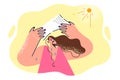 Woman suffering from heatstroke tries to hide from summer sun by holding sheet of paper over head