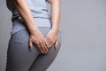 Woman suffering from hemorrhoids and hand holding her bottom because having Abdominal pain. Health care concept Royalty Free Stock Photo