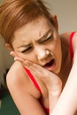 Woman suffering from jaw pain, toothache, tooth sensitivity