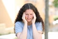 Woman suffering migraine in the street Royalty Free Stock Photo