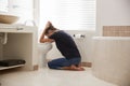 Woman Suffering With Morning Sickness In Bathroom At Home Royalty Free Stock Photo