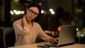 Woman suffering neck pain after working on laptop for long period, muscle strain