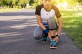 Woman suffering from pain in leg injury after sport exercise running jogging and workout outdoor at park Royalty Free Stock Photo