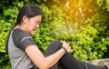 Woman suffering from pain in leg injury after sport exercise running jogging and workout outdoor Royalty Free Stock Photo