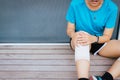 Woman suffering from pain in leg injury after sport exercise running jogging and workout outdoor Royalty Free Stock Photo