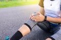 Woman suffering from pain in legs,knee injury after sport exercise running jogging and workout Royalty Free Stock Photo