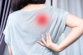 Woman suffering from Scapulocostal Syndrome Back and Shoulder Muscle Pain Royalty Free Stock Photo
