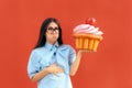 Woman Suffering Stomach Ache After Eating Too Much Cupcake Royalty Free Stock Photo