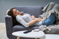 Woman Suffering From Stomachache On Sofa Royalty Free Stock Photo