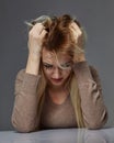 Woman suffering from stress or headache while being offended by pain Royalty Free Stock Photo