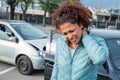 Woman suffering whiplash after bad cars pile up