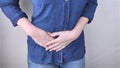 A woman suffers from pain in the appendix. Acute appendicitis, Crohn`s disease, or inflammatory bowel disease. Surgeon examination