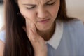 Woman suffers from strong tooth ache closeup view frowny face Royalty Free Stock Photo