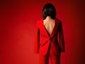 Woman in Suit Back to front. Fashion Girl Rear view with naked Back and Bob Hair Style. Backwards of Stylish Model in Red Classic Royalty Free Stock Photo