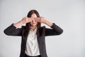 Woman in a suit, blocking her eyes, business compliance concept Royalty Free Stock Photo