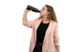 A woman in a suit is drinking from a reusable water bottle. White background