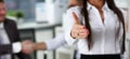 Woman in suit give hand as hello in office