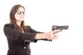 Woman in suit and sunglasses holding a gun Royalty Free Stock Photo