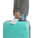 Woman with suitcase, antiseptic spray and protective mask on white background, closeup. Travelling during coronavirus pandemic