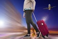 Woman with suitcase awaiting aircraft