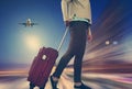 Woman with suitcase awaiting aircraft Royalty Free Stock Photo