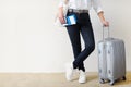 Woman with the suitcase goes on a journey. Travel insurance.