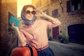 Woman with a suitcase travel on street of italian city Royalty Free Stock Photo