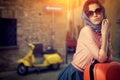 Woman with a suitcase travel on street of italian city Royalty Free Stock Photo