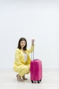 A woman with suitcase in the waiting room, wait for flight. Royalty Free Stock Photo