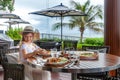 Woman in summer attire eating at