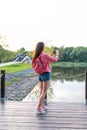 Woman summer in city near lake, river pond, photo landscape smartphone, recording video to Internet, application Royalty Free Stock Photo