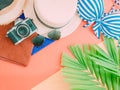 Woman summer cloth accessorie with palm leaf , camera and beach Royalty Free Stock Photo