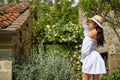 Woman in summer dress walking and running joyful and cheerful smiling in Tuscany, Italy