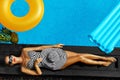 Woman Summer Fashion. Girl Sunbathing By Swimming Pool. Beauty