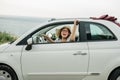 Woman in summer hat driver holding car keys driving her new car cabriolet - automobile and purchase concept Royalty Free Stock Photo