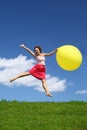 Woman in summer pushes off from earth Royalty Free Stock Photo