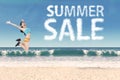 Woman with summer sale clouds at beach Royalty Free Stock Photo