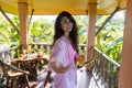 Woman On Summer Terrace Hold Hand Drink Orange Juice, Happy Smiling Girl In Morning Welcoming Gesture Outdoors Royalty Free Stock Photo