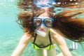 Woman in summer vacation snorkeling in ocean