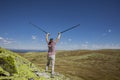 Woman on a summit in victory pose Royalty Free Stock Photo