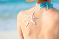 Woman with sun drawn from sunscreen on back Royalty Free Stock Photo