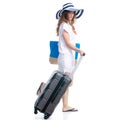 Woman in sun hat, sunglasses and beach bag with suitcase luggage summer smiling happiness looking walking goes Royalty Free Stock Photo