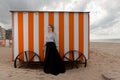 Woman sun sand hut, De Panne, Belgium Royalty Free Stock Photo