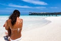 Woman with sun-shaped sunscreen drawing on her back Royalty Free Stock Photo