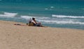 A woman sunbathe in El Arenal beach in Mallorca wide