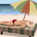 Woman sunbathes on the beach.